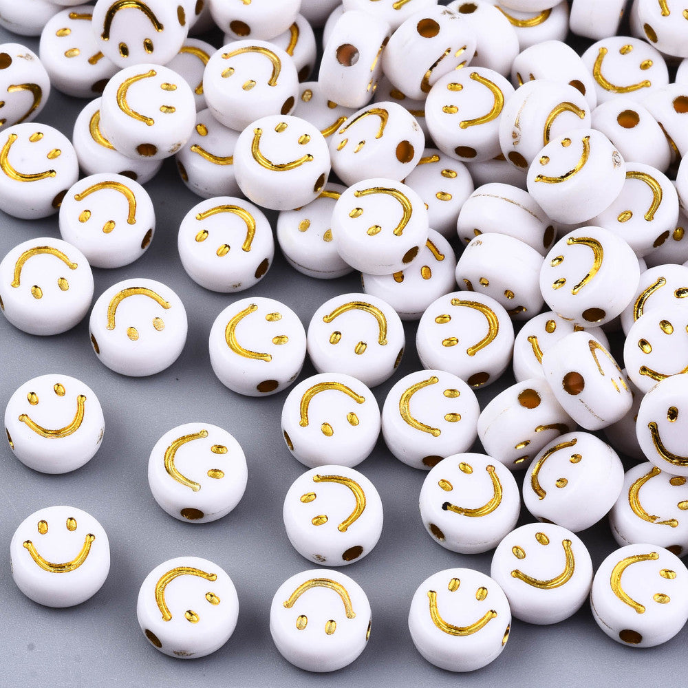 Smiley face gold plastic (100pzsaprox)